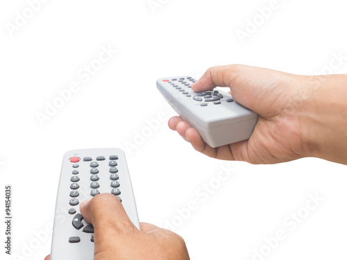 Hand holding remote control photo