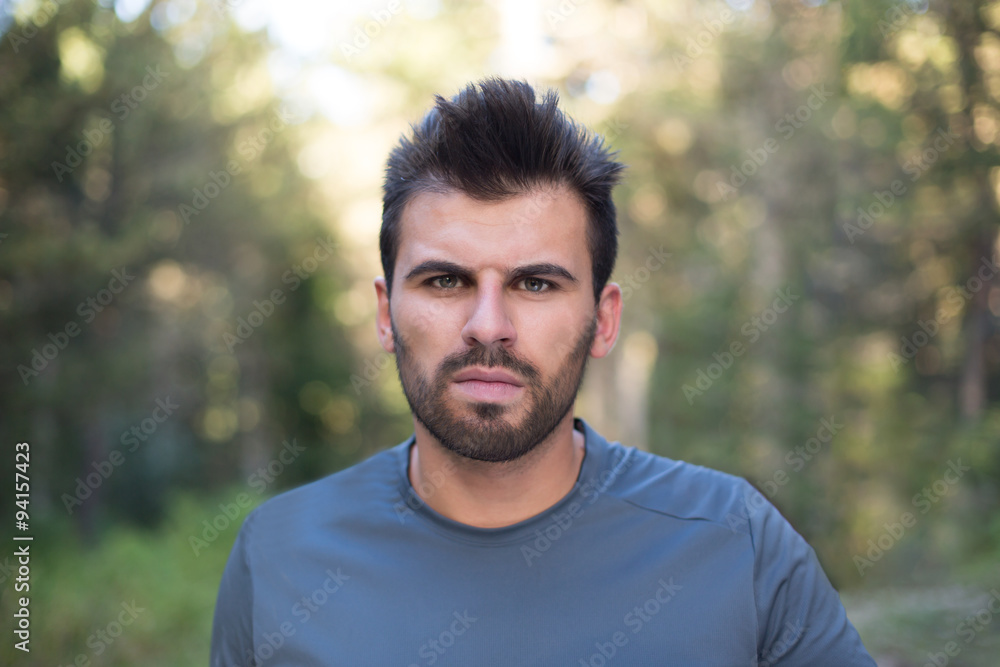 Portrait of handsome runner with beard in nature Portrait of handsome runner with beard in nature
