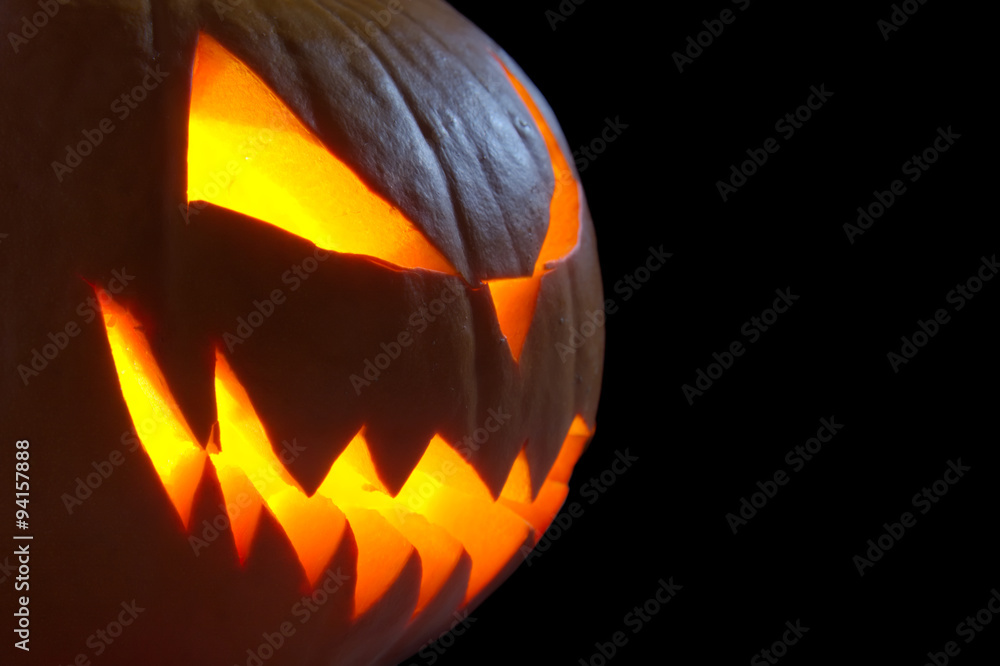 Scary face of jack o lantern on black background Stock Photo | Adobe Stock