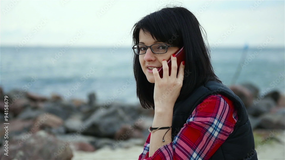 young woman talking on the phone, close up young woman talking on the phone, close up