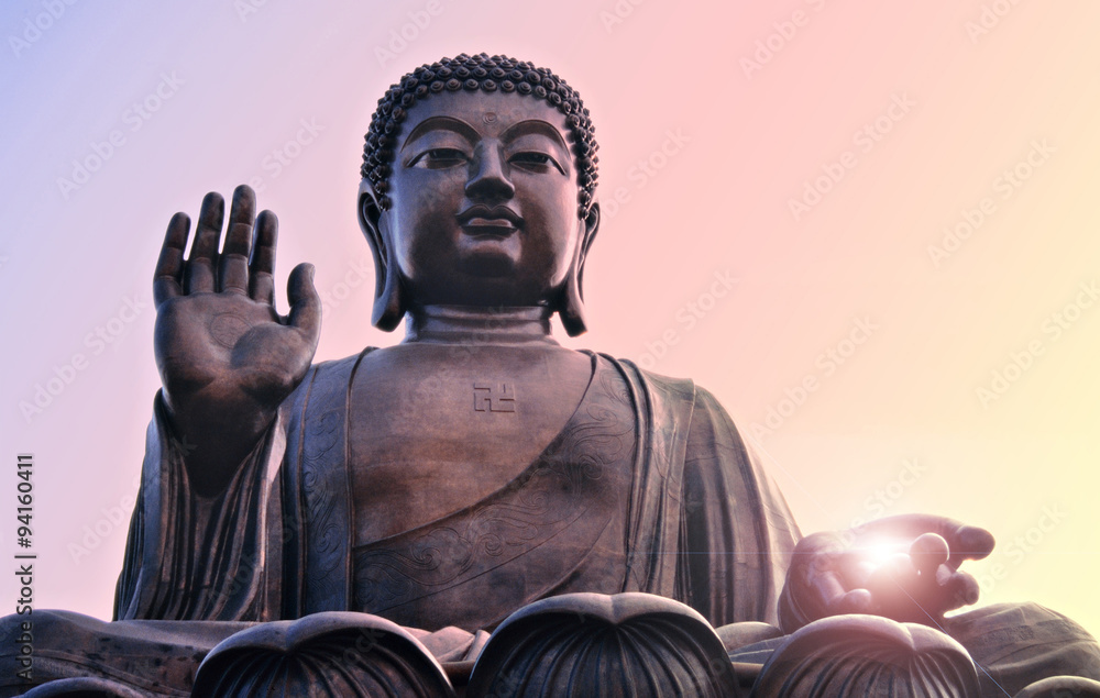 Buddha statue at Po Lin, Hong Kong. Bright light from hand. Stock Photo