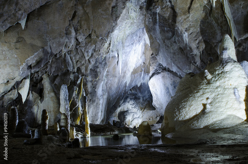 large cold cave with stalactites and stalagmites