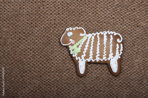 Christmas cookies in the form of a sheep on a knitted woolen kni photo