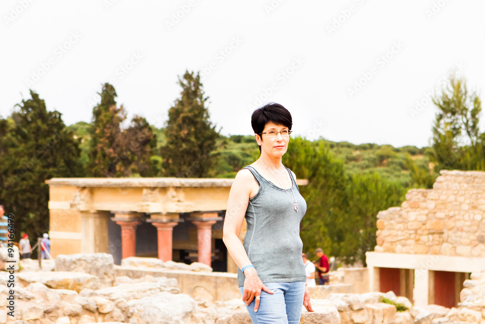 woman on the background of ancient town. Crete