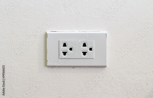 Light socket on white wall