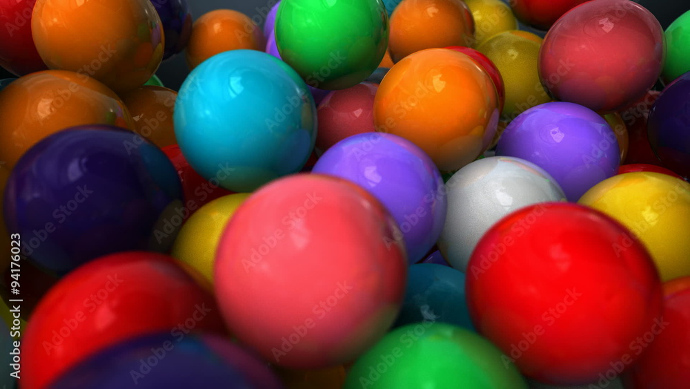 An extreme closeup pan out across a group of multicolored gum balls An extreme closeup pan out across a group of multicolored gum balls