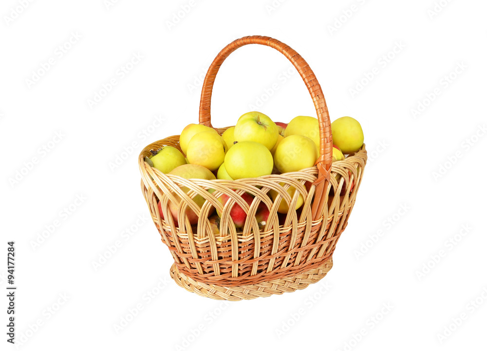 Apple in a wattled basket, isolated on white background Apple in a wattled basket, isolated on white background