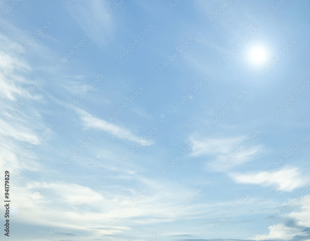 Obraz premium clouds and sun in the blue sky