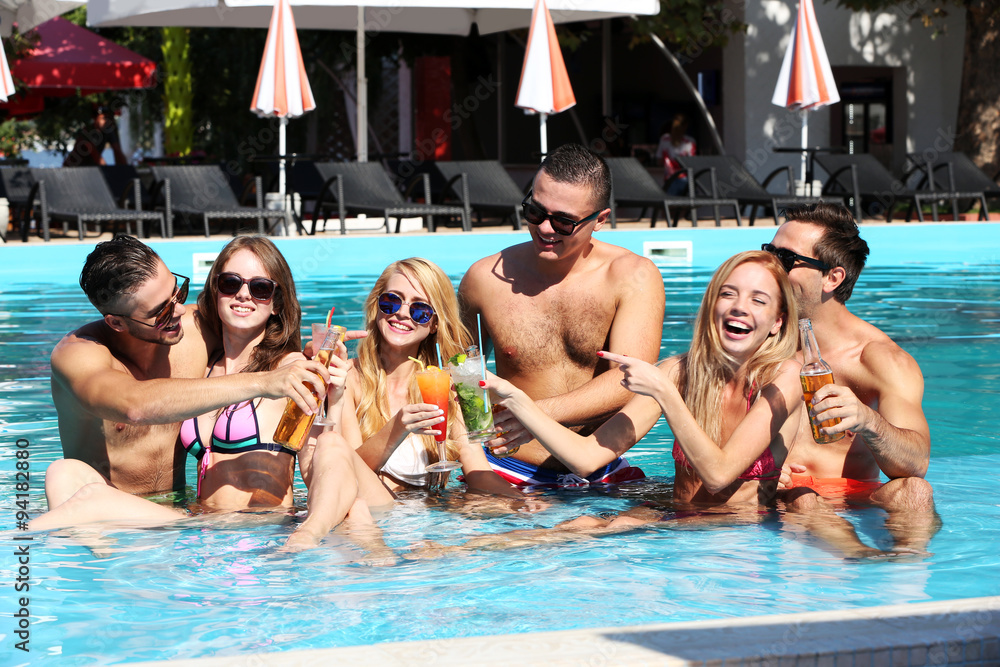 Young people having fun in the swimming pool