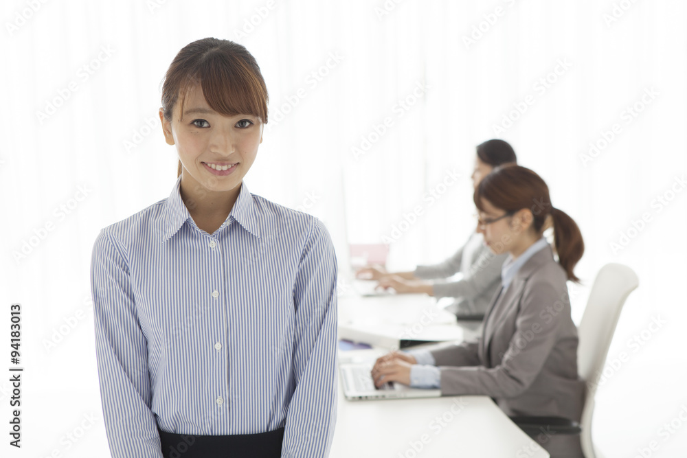 Women's portrait working in office Women's portrait working in office