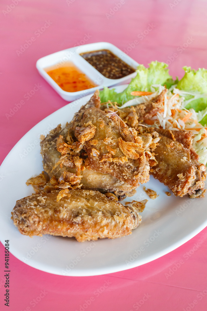 Fried chicken with sauce. selective focus Fried chicken with sauce. selective focus