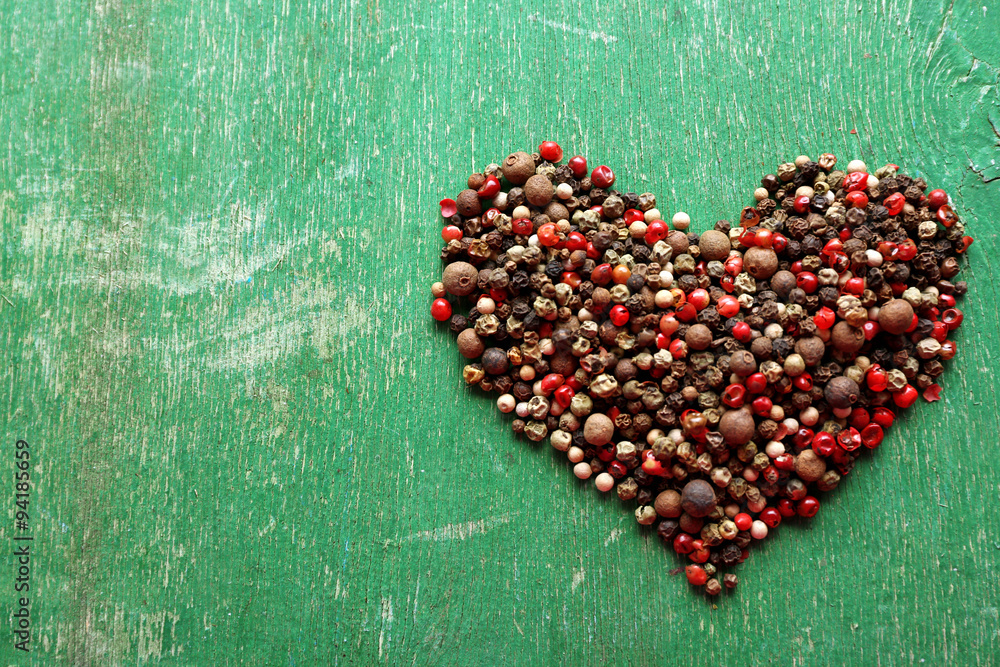 Heart shaped spices on old wooden background Heart shaped spices on old wooden background