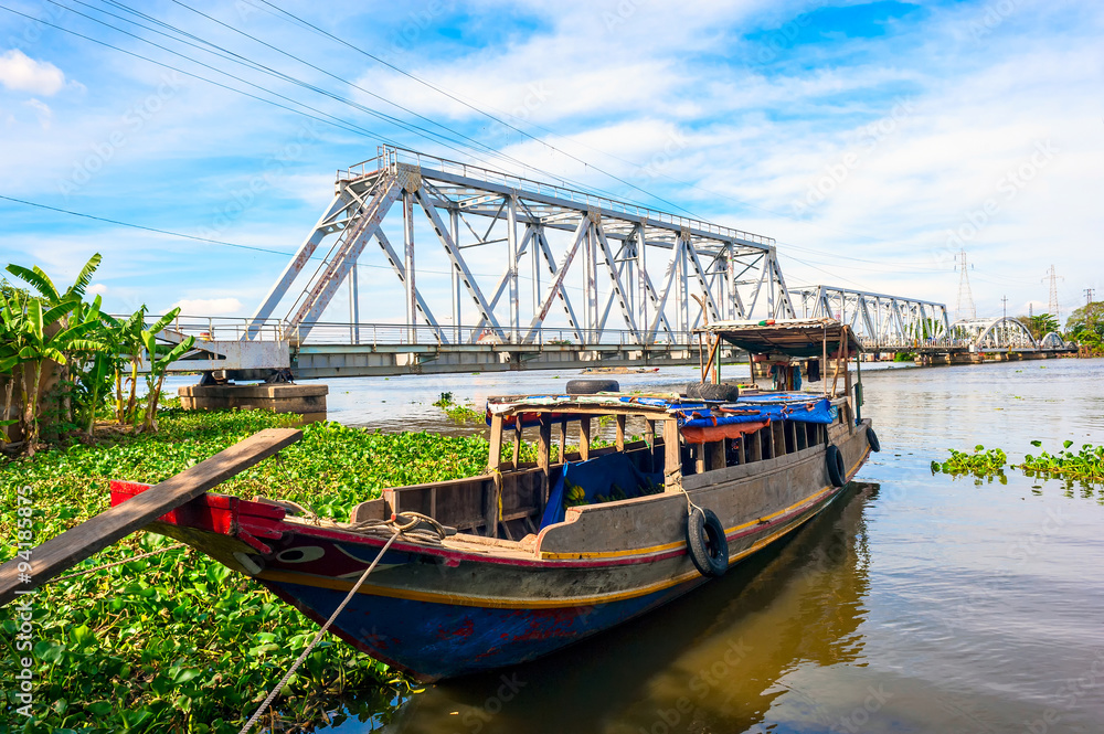 Wooden boat anchoring on Saigon river in Hochiminh city, Vietnam. Wooden boat anchoring on Saigon river in Hochiminh city, Vietnam.