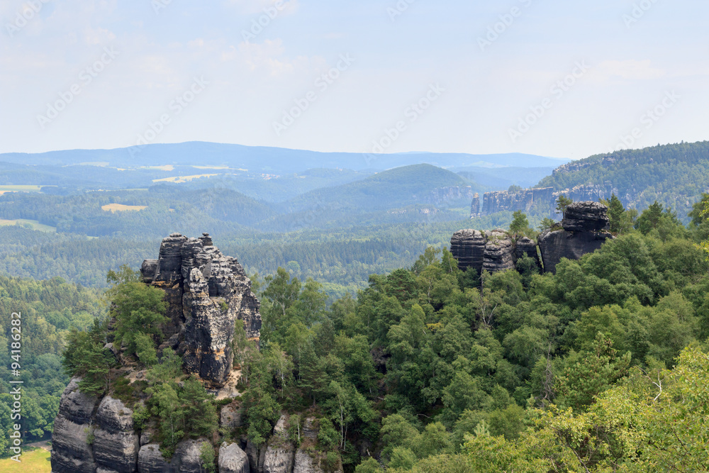 Obraz premium Panorama with Group of rocks Affensteine seen from Schrammstein viewing point in Saxon Switzerland
