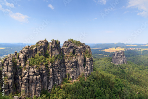 Panorama with Group of rocks Schrammsteine and Falkenstein seen from viewing point in Saxon Switzerland