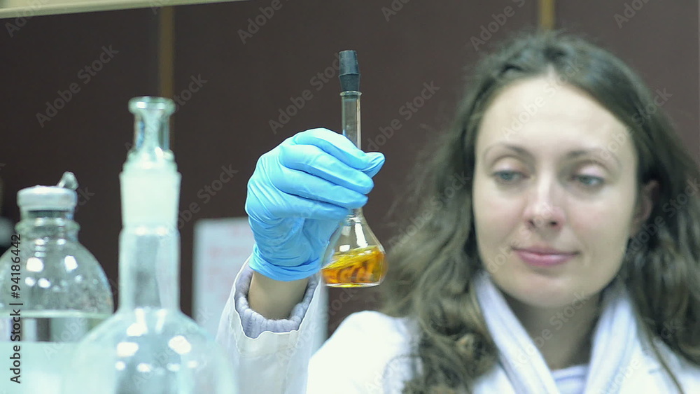Researcher conducting experiments in a laboratory Researcher conducting experiments in a laboratory