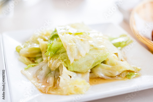 Fried cabbage with Shell oil on white plate,Thai food style