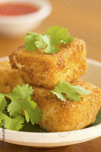 Breaded Fried Silken Tofu w Chili Oil in Background Non sharpen