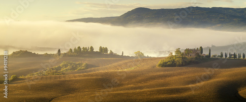 farmhouse in the Tuscan hills of the beautiful autumn morning