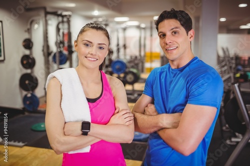 Fit couple smiling at camera