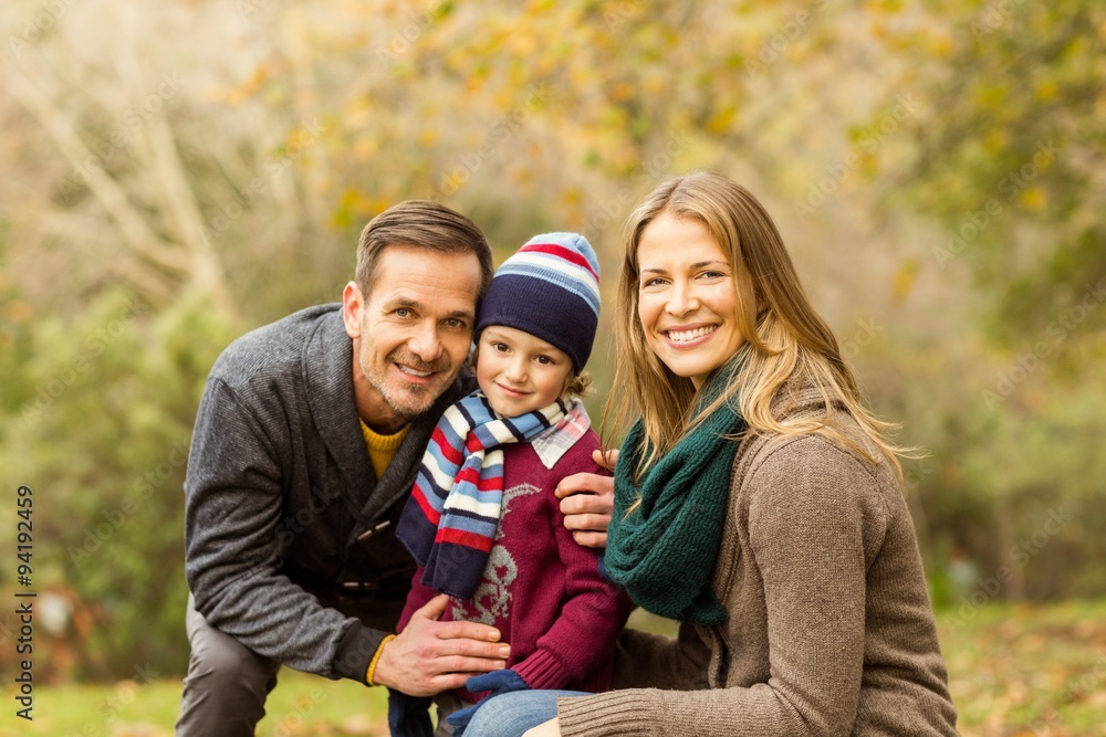 Smiling young couple with little boy posing Smiling young couple with little boy posing