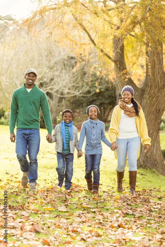 Portrait of a young smiling family walking Portrait of a young smiling family walking