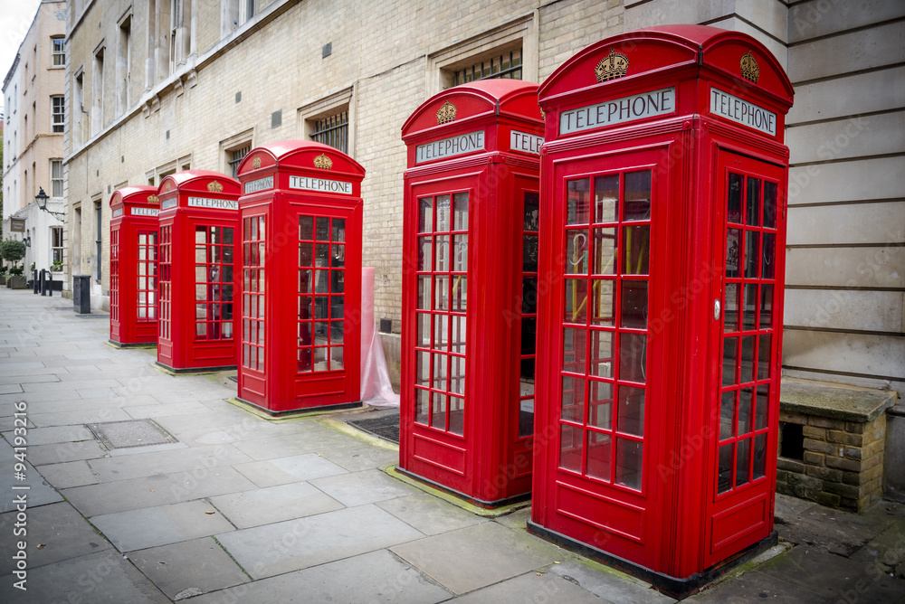 Traditional red telephone boxes in London, UK Traditional red telephone boxes in London, UK