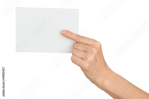 Humans hand pointing at blank paper