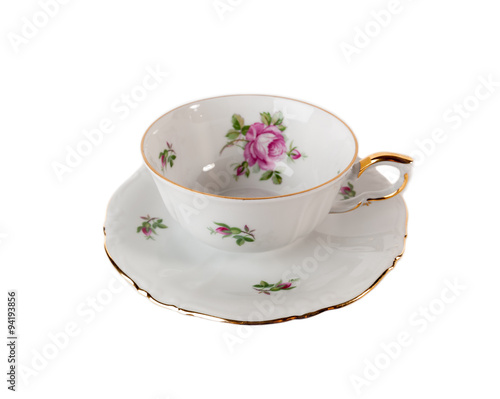 Porcelain teacup and saucer with rose in classic style