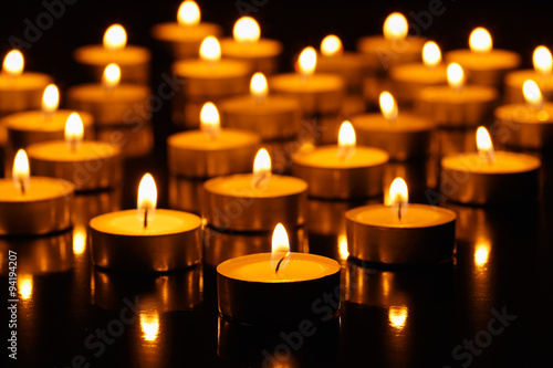 Many burning candles with shallow depth of field