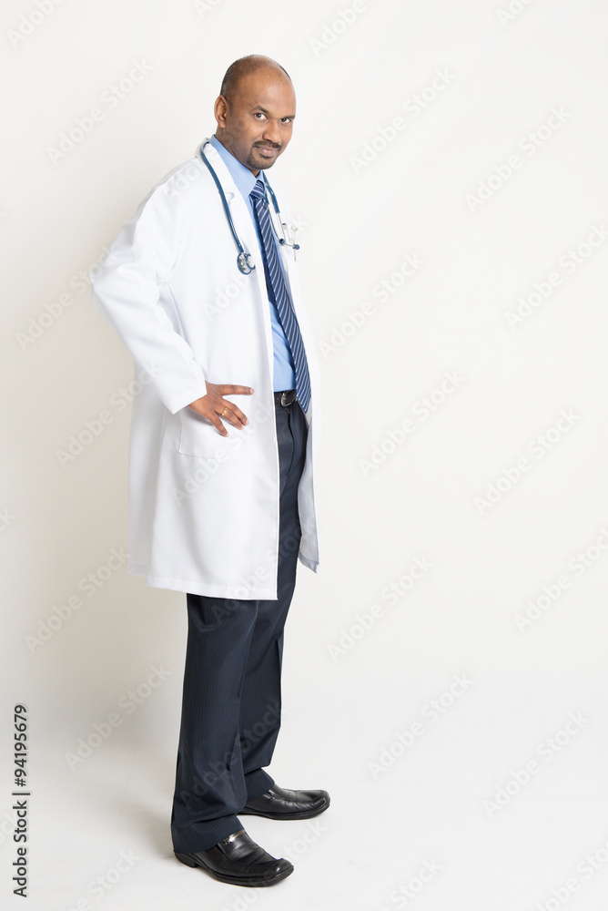 Mature Indian doctor full length side view Mature Indian doctor full length side view