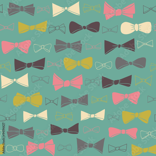 Cute seamless pattern of colored bows on green background.