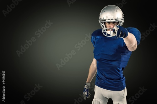 Composite image of portrait of confident sports player pointing