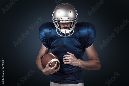 Composite image of confident sports player holding ball