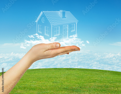 Hand holding cloud house