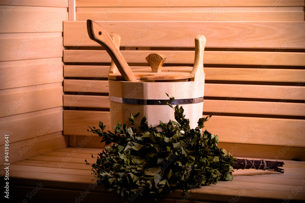Equipment for sauna in light wooden cozy interior. Toned