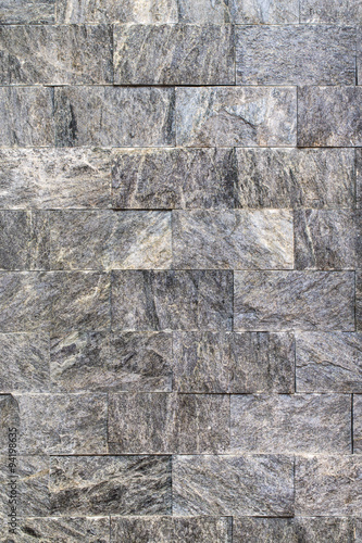 Gray color wall of natural stone. Background texture