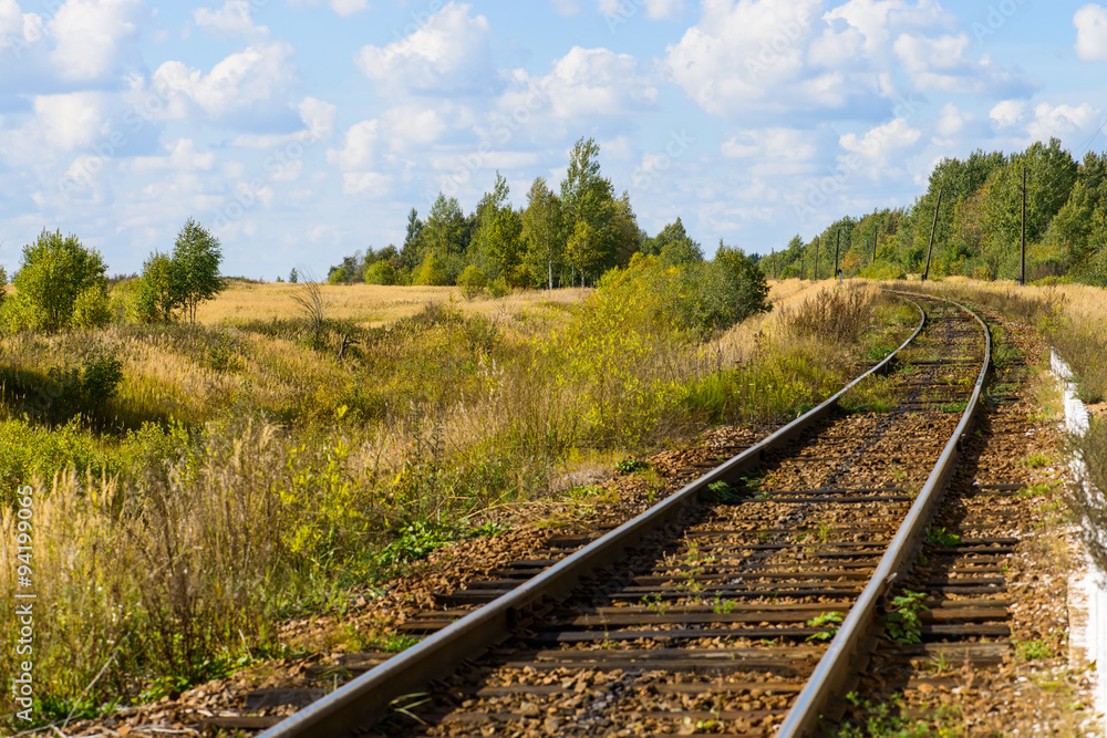 Autumn Industrial landscape, railway receding into the distance