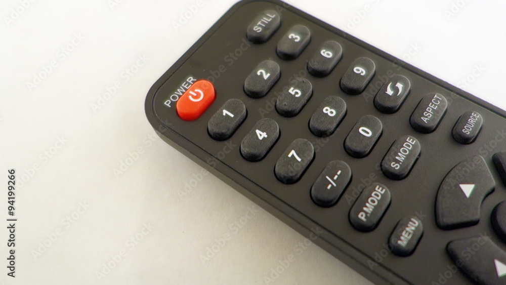 Finger Touching The Channel Button On A TV Remote Finger Touching The Channel Button On A TV Remote