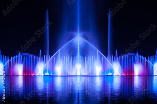 Musical fountain with colorful illuminations at night. Ukraine,