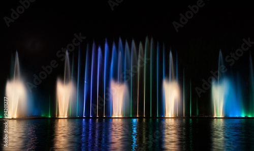 Musical fountain with colorful illuminations at night. Ukraine,