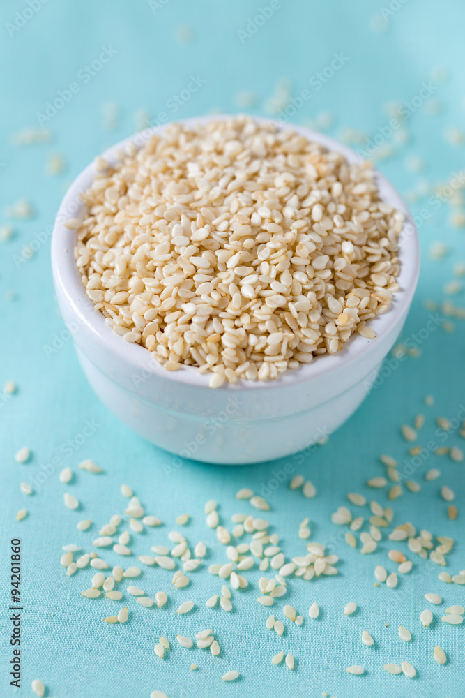 sesame seeds on wooden surface sesame seeds on wooden surface