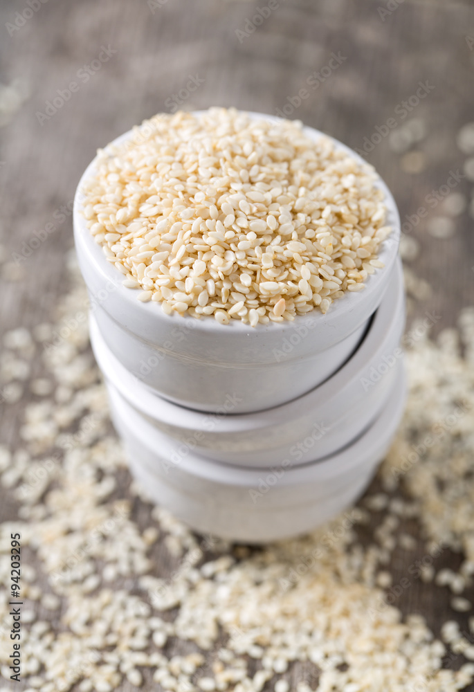 sesame seeds on wooden surface sesame seeds on wooden surface