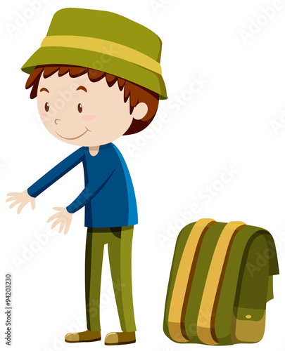 Man standing next to backpack