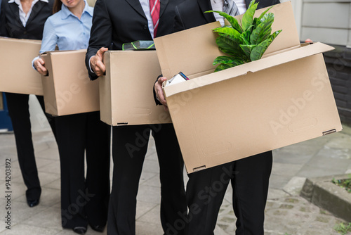 Businesspeople With Cardboard Boxes photo
