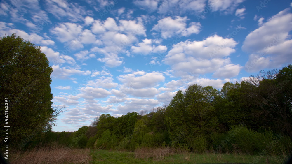 landscape with clouds, blue sky and forest. Time lapse. 4K ( 4096x2304) landscape with clouds, blue sky and forest. Time lapse. 4K ( 4096x2304)