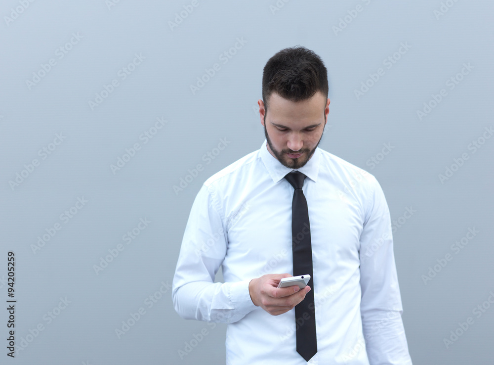 Businessman using cellphone, handsome businessman on creative ba Businessman using cellphone, handsome businessman on creative ba