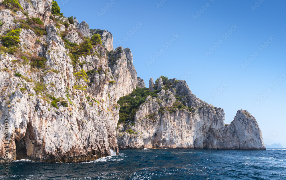 Touristic motorboat enters the grotto. Capri