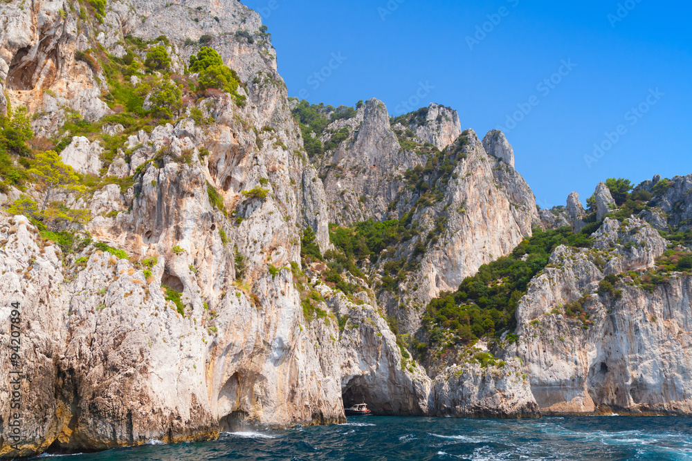 Touristic motorboat enters the grotto of Capri