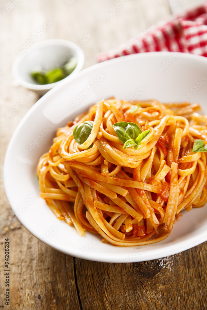 Pasta with vegetable sauce and green basil Pasta with vegetable sauce and green basil